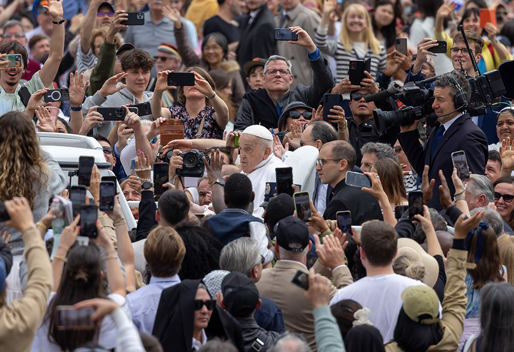 Pope Francis, in the popemobile, greets people in St. Peter's Square at the Vatican after giving his Easter blessing April 20, 2025. Francis died April 21 at age 88. (CNS/Pablo Esparza)
