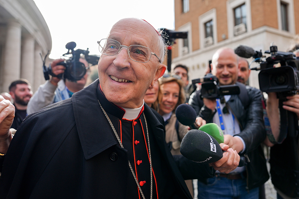 Cardinal Fernando Filoni, grand master of the Equestrian Order of the Holy Sepulchre of Jerusalem, speaks with the press as he approaches the Petriano entrance of the Vatican next to St. Peter's Square to attend a general congregation meeting in the New Synod Hall at the Vatican April 24, 2025. (CNS/Lola Gomez)
