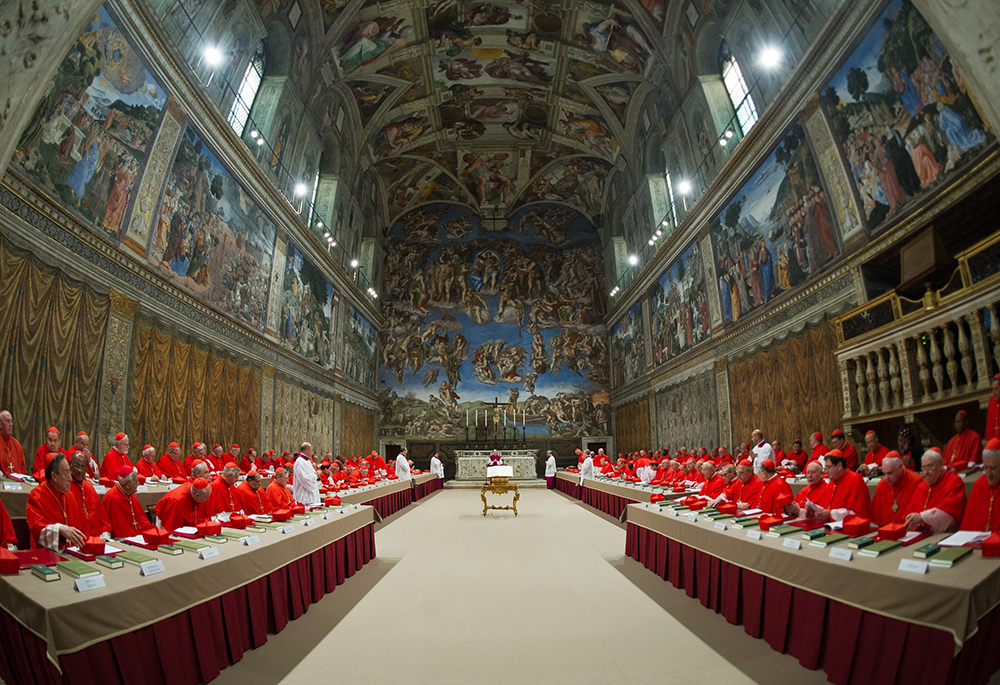 Cardinals from around the world pray in the Sistine Chapel at the Vatican March 12, 2013, before beginning the conclave to elect a successor to Pope Benedict XVI. The following day, on the fifth ballot, they elected Cardinal Jorge Mario Bergoglio of Buenos Aires, Argentina, who chose the name Francis. (CNS/Vatican Media)