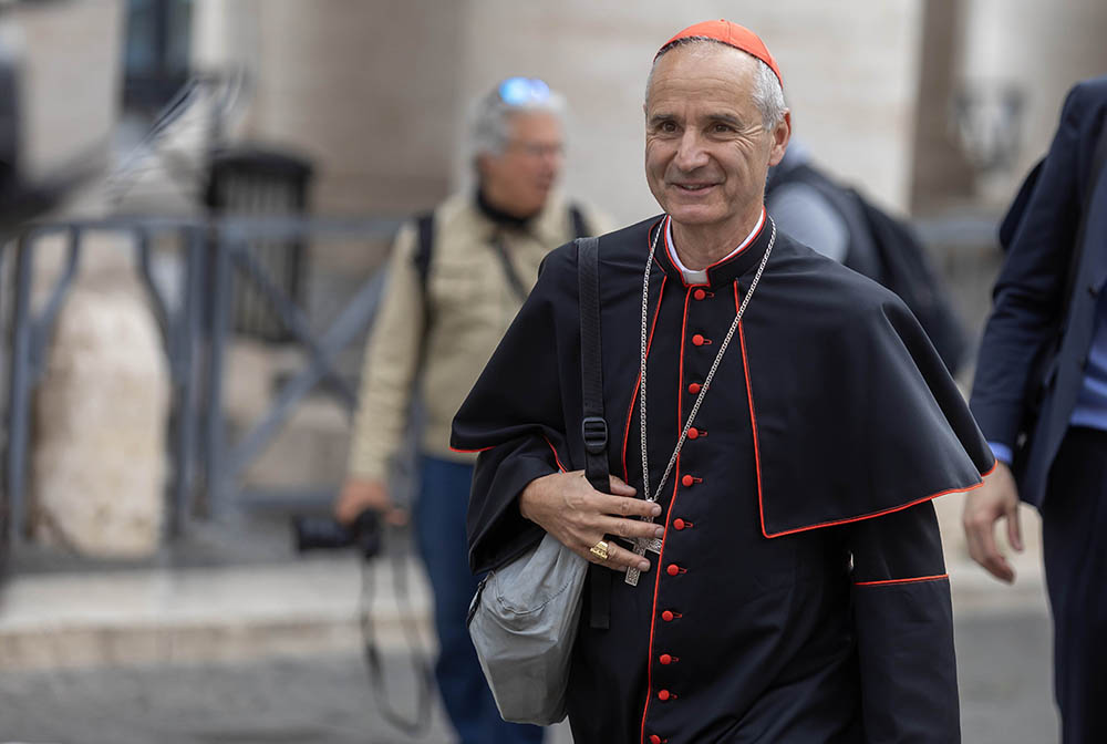 Cardinal Jean-Paul Vesco of Algiers, Algeria, approaches the Petriano entrance to the Vatican next to St. Peter's Square to attend the fifth general congregation meeting of cardinals April 28, 2025. (CNS/Pablo Esparza)