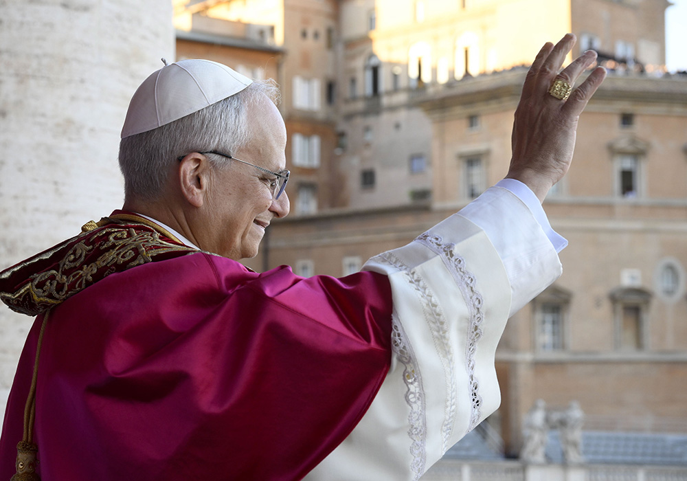 Pope Leo XIV, the former Cardinal Robert F. Prevost, waves to the crowds in St. Peter's Square at the Vatican after his election as pope May 8, 2025. The new pope was born in Chicago. (CNS/Vatican Media)