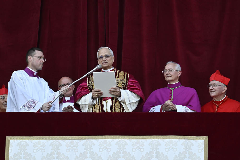Pope Leo XIV, the former Cardinal Robert Prevost, waves to the crowds in St. Peter's Square at the Vatican after his election as pope May 8, 2025. The new pope was born in Chicago. (CNS/Vatican Media)
