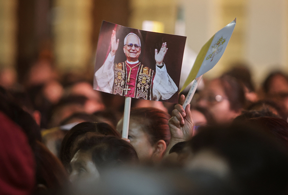 Someone holds a placard with an image of Pope Leo XIV on the day of a Mass at the Cathedral of Santa Maria de Chiclayo in Peru May 10, 2025, celebrating the election of Pope Leo XIV May 8 at the Vatican. The new pope was bishop of Chiclayo between 2015 and 2023. (OSV News/Reuters/Sebastian Castaneda)