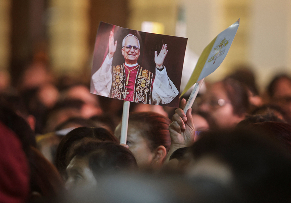 Someone holds a placard with an image of Pope Leo XIV on the day of a Mass at the Cathedral of Santa Maria de Chiclayo in Peru May 10, 2025, celebrating the election of Pope Leo XIV May 8 at the Vatican. The new pope was bishop of Chiclayo between 2015 and 2023. (OSV News/Reuters/Sebastian Castaneda)