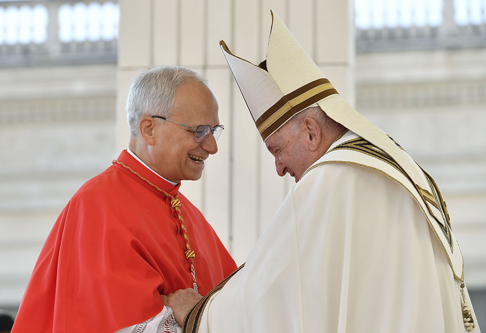 Pope Francis greets then-Cardinal Robert Prevost during a consistory in St. Peter's Square at the Vatican Sept. 30, 2023. Prevost became the first U.S.-born pope in history when he was elected at the Vatican May 8, 2025, choosing the papal name Leo XIV. Early indications show Pope Leo will continue to build on Pope Francis-era advances in the church's interfaith relations. (CNS/Vatican Media)