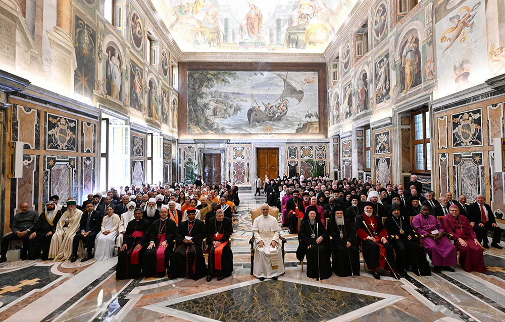 Pope Leo XIV poses for a group photo with religious leaders who came to Rome for his inauguration Mass, during a meeting at the Vatican May 19, 2025. (CNS/Vatican Media)