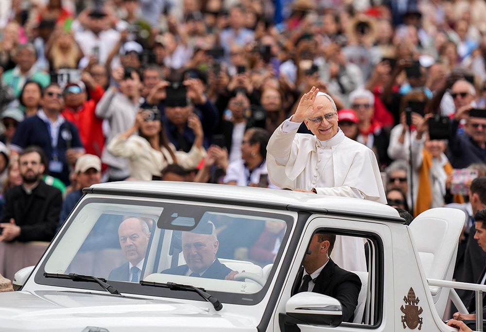 Pope Leo XIV rides through St. Peter's Square at the Vatican May 21, 2025, before holding his first weekly general audience. (CNS/Lola Gomez)