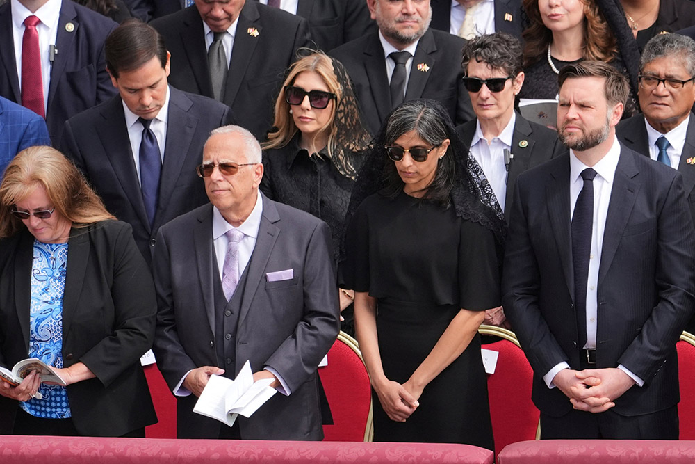 U.S. Vice President JD Vance, right, and second lady Usha Vance stand next to Louis Prevost, brother of Pope Leo XIV, and his wife, Deborah, left, at the inauguration Mass of the new pope's pontificate in St. Peter's Square at the Vatican May 18, 2025. U.S. President Donald Trump and Vance met Louis and Deborah Prevost at the White House May 20. (OSV News/Jacquelyn Martin, pool via Reuters)