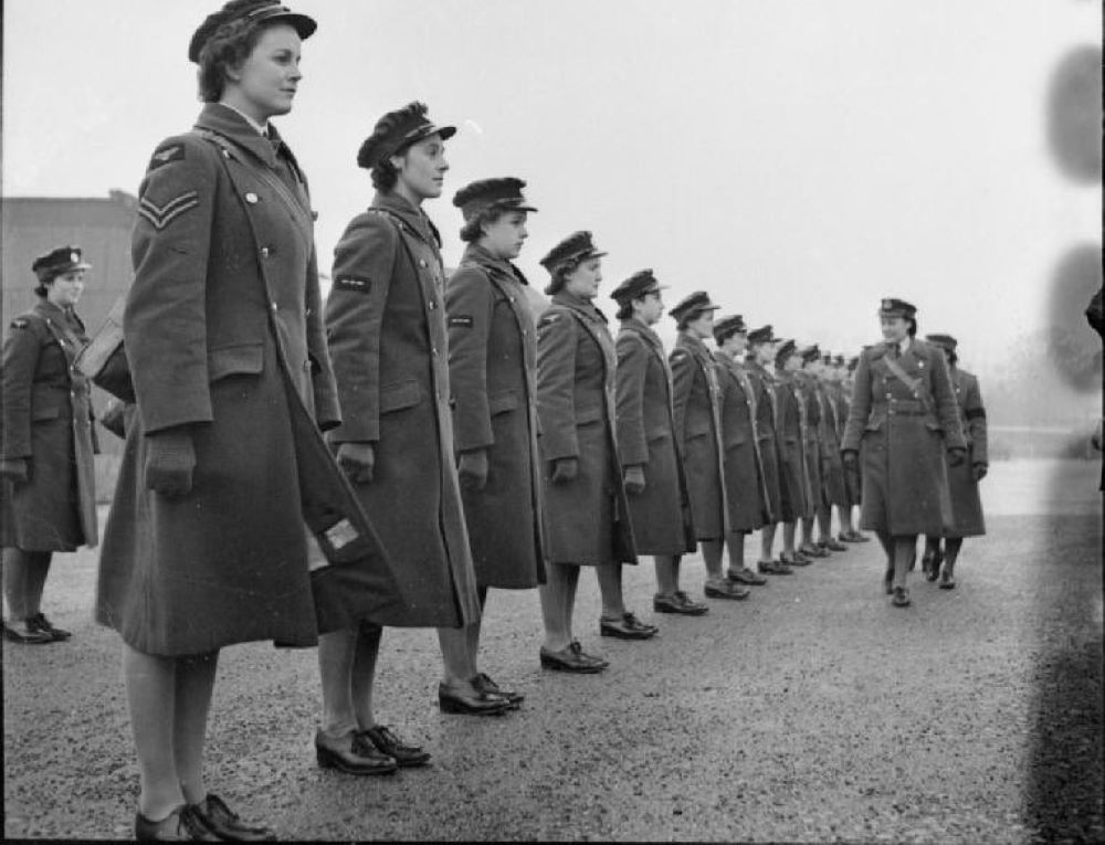 British Women's Auxiliary Air Force members stand during inspection. British Women's Auxiliary Air Force members stand during inspection.