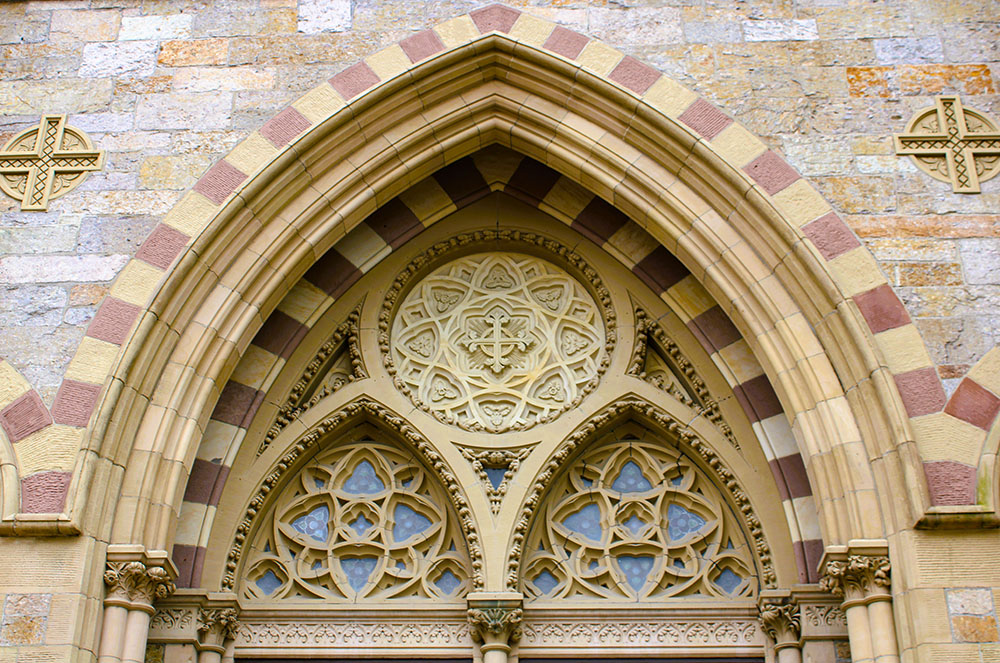 The tympanum above the central entrance to the Cathedral of the Holy Cross in Boston (Wikimedia Commons/Farragutful)