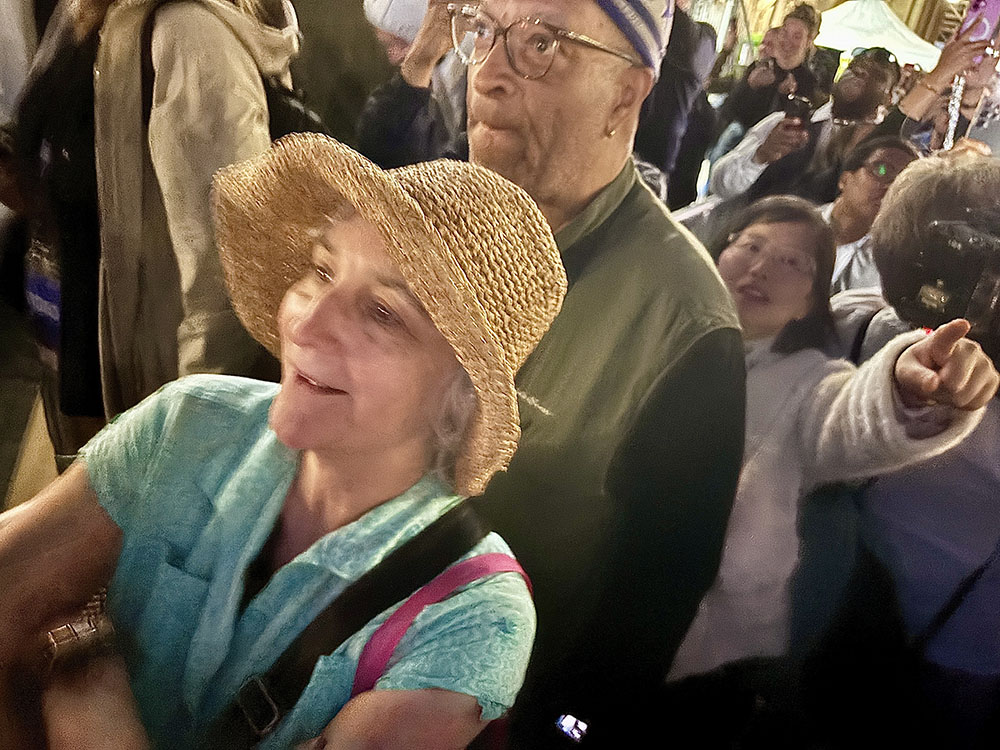 Retirees Laureen and Gary Toney, of Annapolis, Maryland, react to expected black smoke. (NCR photo/James V. Grimaldi)