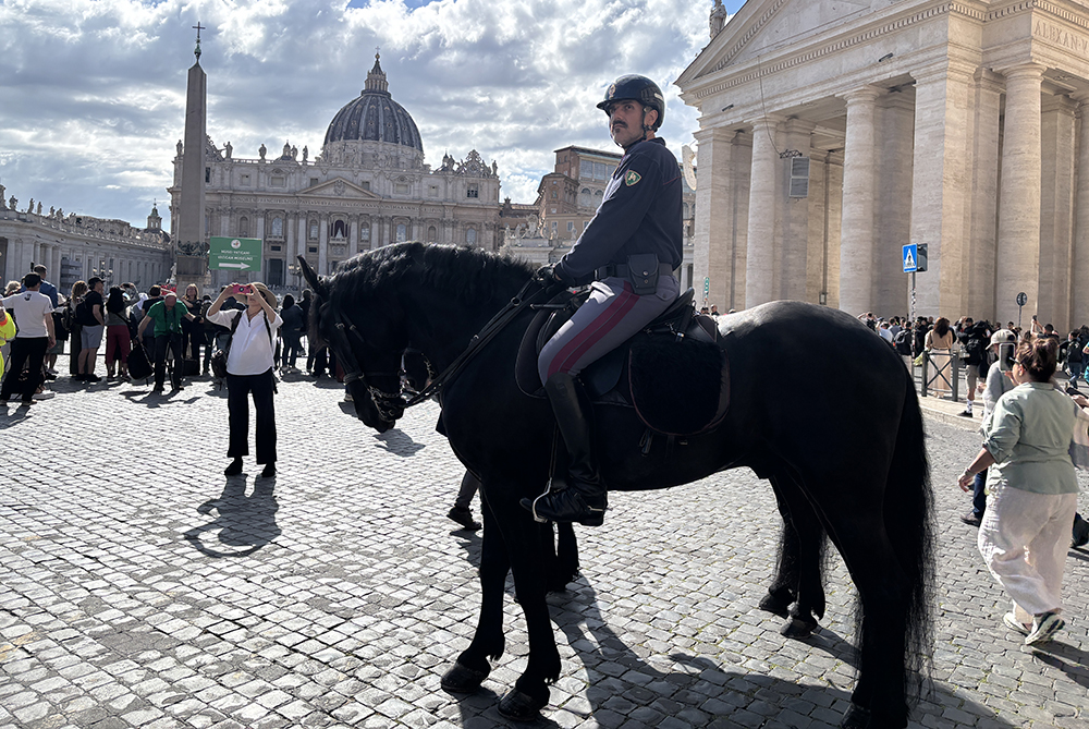 Mounted police prepare for the crowds as cardinals proceed into the Sistine Chapel on Wednesday afternoon in Rome. (NCR photo/James V. Grimaldi)