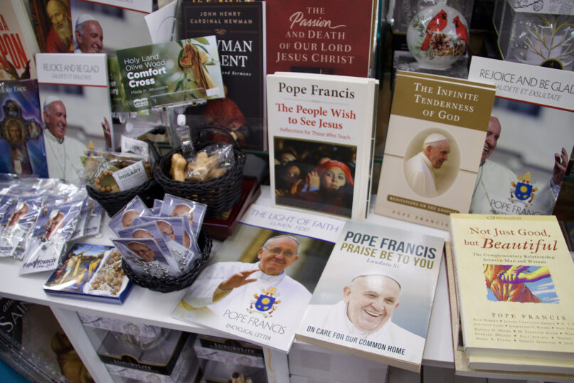 A table featuring Pope Francis merchandise at the Advent Shop in Massapequa, Long Island, New York, on May 1, 2025. (Fiona Murphy)