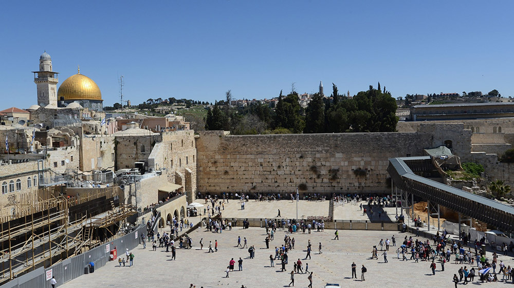 Pilgrims walk near the Western Wall, Judaism's holiest site, in the Old City of Jerusalem in this March 28, 2014, file photo. (CNS/Debbie Hill)