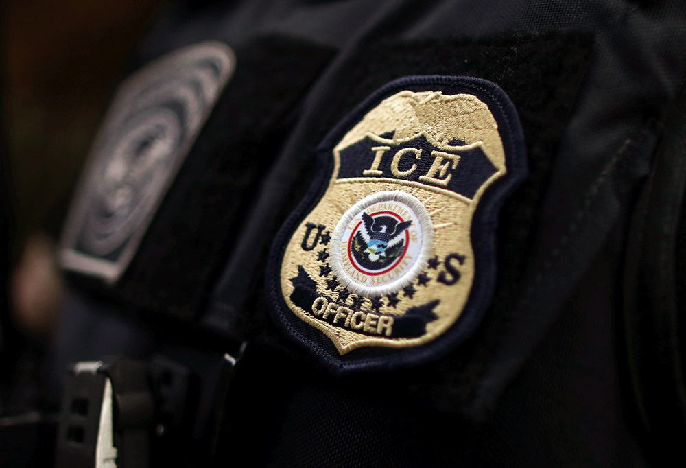 The badge of a U.S. Immigration and Customs Enforcement official is seen in this undated illustration photo. (OSV News/Reuters/Lucy Nicholson)