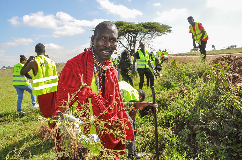 Amos Kwaite, a member of the Maasai community, joins Kenyans, including members of the Laudato Si Movement, in a cleanup of Nairobi National Park June 4. 2022, as part of the observance of World Environment Day. (CNS/Fredrick Nzwili)