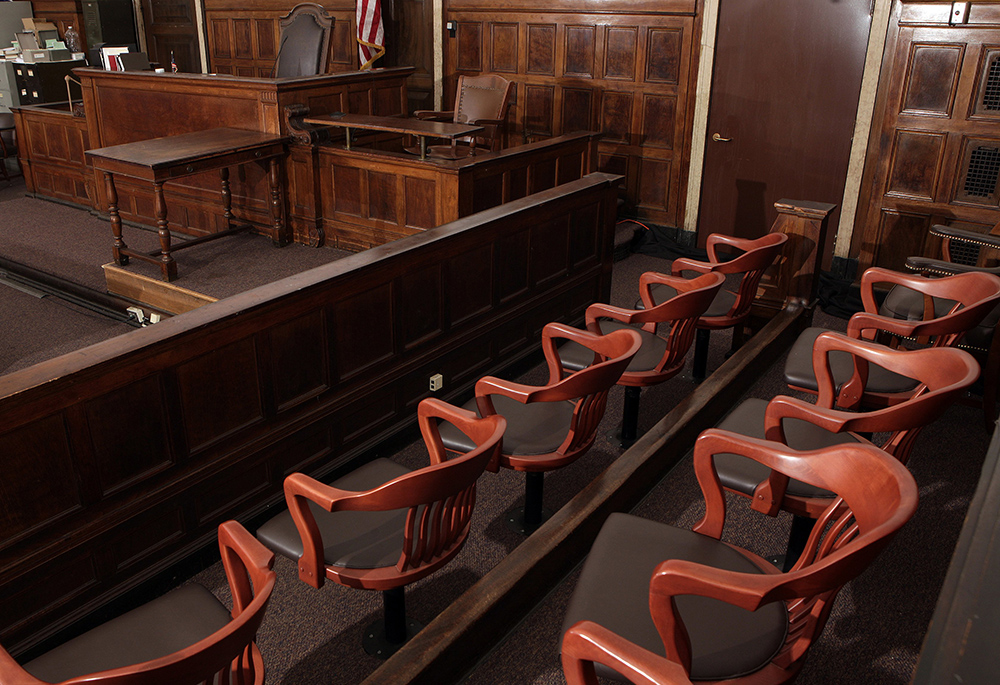 A jury box, judge's chair and witness stand are seen in this courtroom illustration photo. A federal jury in New Orleans has ordered the Holy Cross order to pay nearly $2.4 million in damages to a man who reported being sexually abused by one of its members in the late 1960s. (OSV News/Reuters/Chip East)