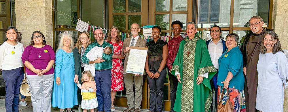Participants pose for a photo with Archbishop Gustavo García-Siller on Sunday, July 28, 2024, at San Fernando Cathedral when, at a liturgy, Garcia-Siller signed a commitment for the San Antonio Archdiocese to join the Laudato Si' Action Platform. (Courtesy of Catholic Climate Covenant/Diana Marin)