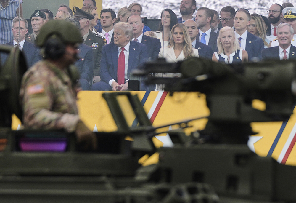 President Donald Trump attends a military parade commemorating the Army's 250th anniversary, coinciding with his 79th birthday, on June 14, 2025, in Washington. (AP Photo/Julia Demaree Nikhinson)