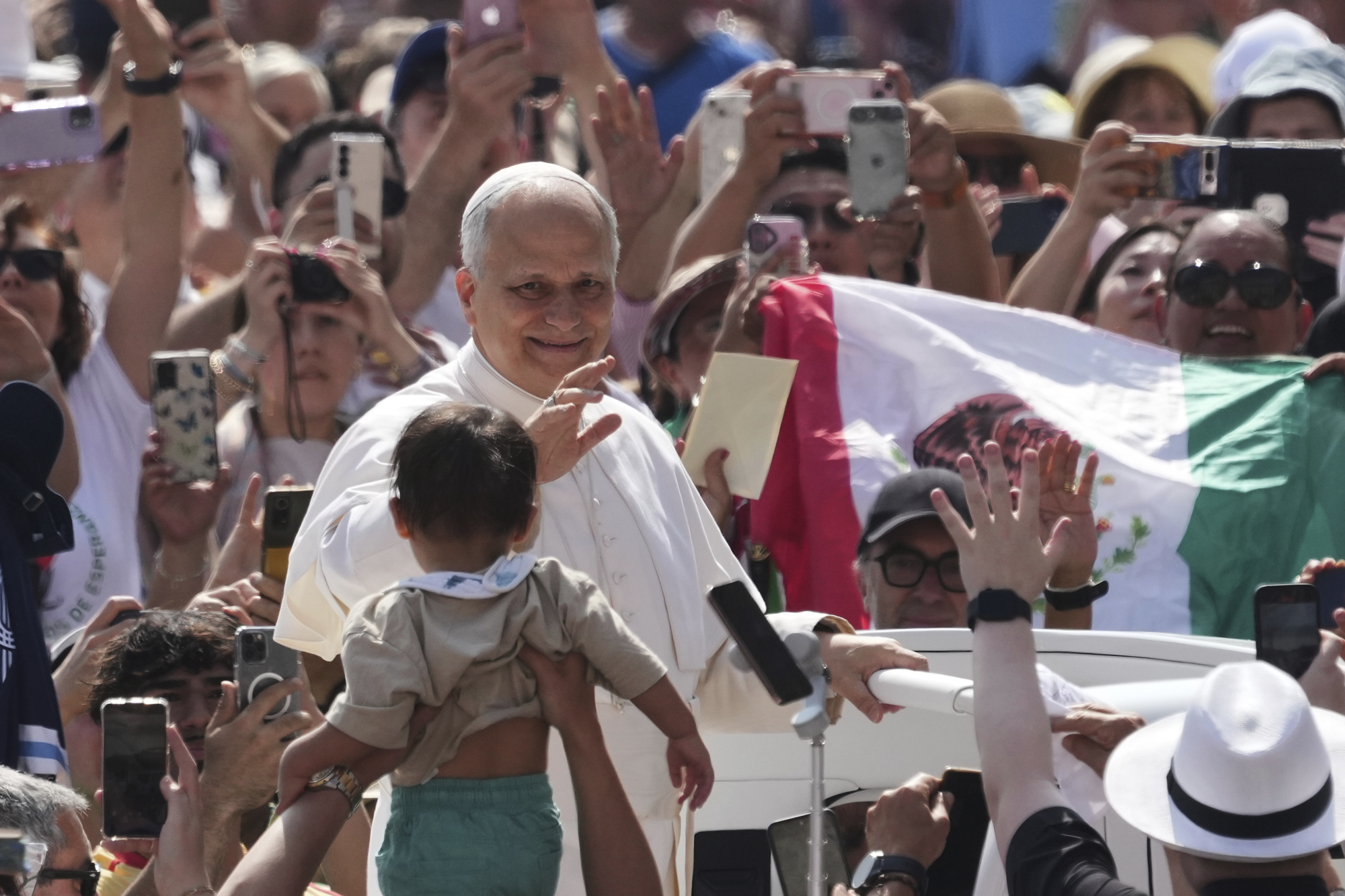 Pope Leo XIV waves as he arrives for his weekly general audience in St. Peter's Square at The Vatican, Wednesday, June 11, 2025. (AP Photo/Andrew Medichini)