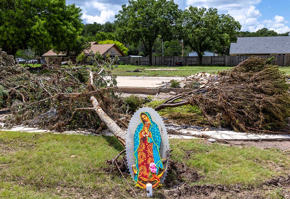 An image of Our Lady of Guadalupe sits next to fallen trees near the Guadalupe River in Hunt, Texas, July 9, 2025, in the aftermath of catastrophic flooding. (OSV News/Reuters/Umit Bektas)