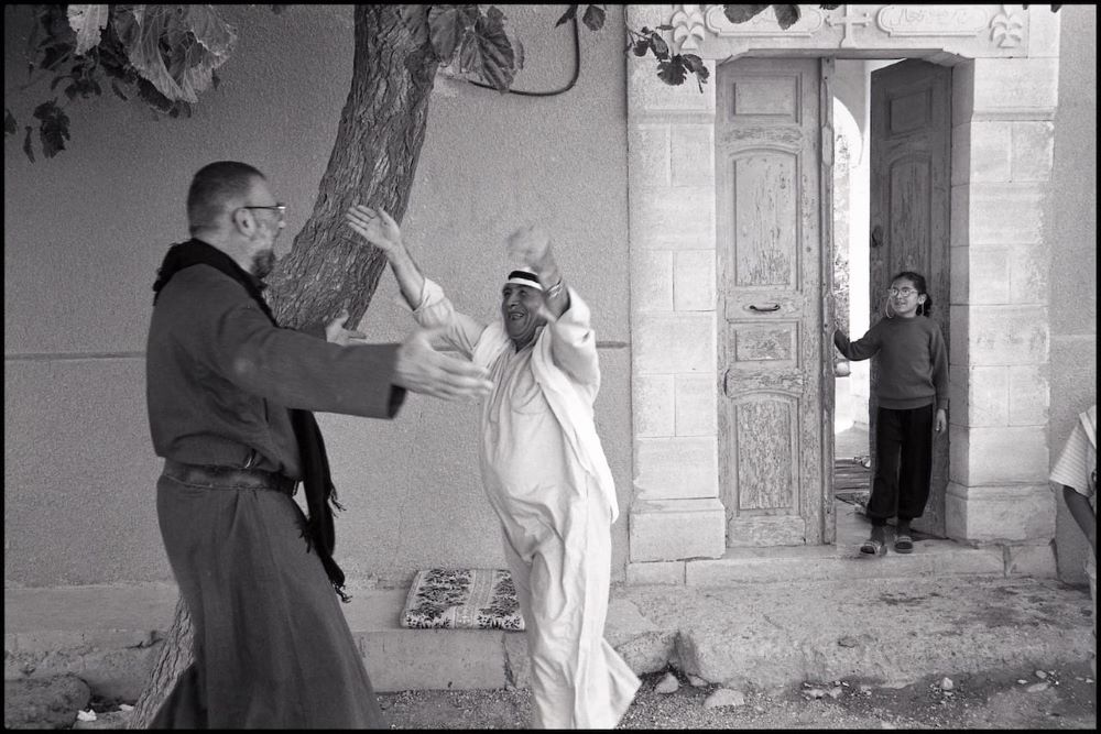 Jesuit Fr. Paolo Dall'Oglio greets a Syrian neighbor. Jesuit Fr. Paolo Dall'Oglio greets a Syrian neighbor.