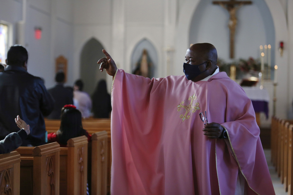 The Rev. Athanasius Abanulo waves to his parishioners after Mass on Dec. 12, 2021, at Immaculate Conception Catholic Church in Wedowee, Ala. (AP Photo/Jessie Wardarski, File) The Rev. Athanasius Abanulo waves to his parishioners after Mass on Dec. 12, 2021, at Immaculate Conception Catholic Church in Wedowee, Ala. (AP Photo/Jessie Wardarski, File)