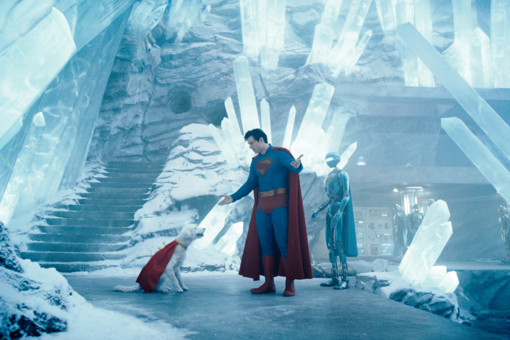Superman and Krypto the Superdog Superman and Krypto the Superdog facing each other in a room full of crystals.
