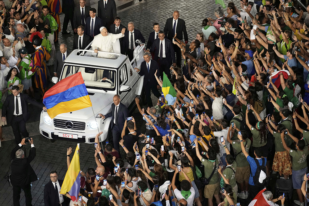 Pope Leo XIV greets faithful in St. Peter's Square at the end of a welcome mass for the Youth Jubilee at the Vatican July 29, 2025. (AP Photo/Gregorio Borgia)