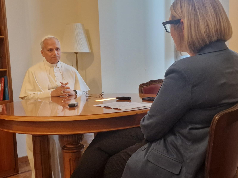 Pope Leo XIV is interviewed Pope Leo XIV sits with Elise Allen, senior correspondent at Crux, for an interview at the pope's residence inside the Vatican's Palazzo Sant'Uffizio July 30, 2025. (CNS/courtesy Crux)
