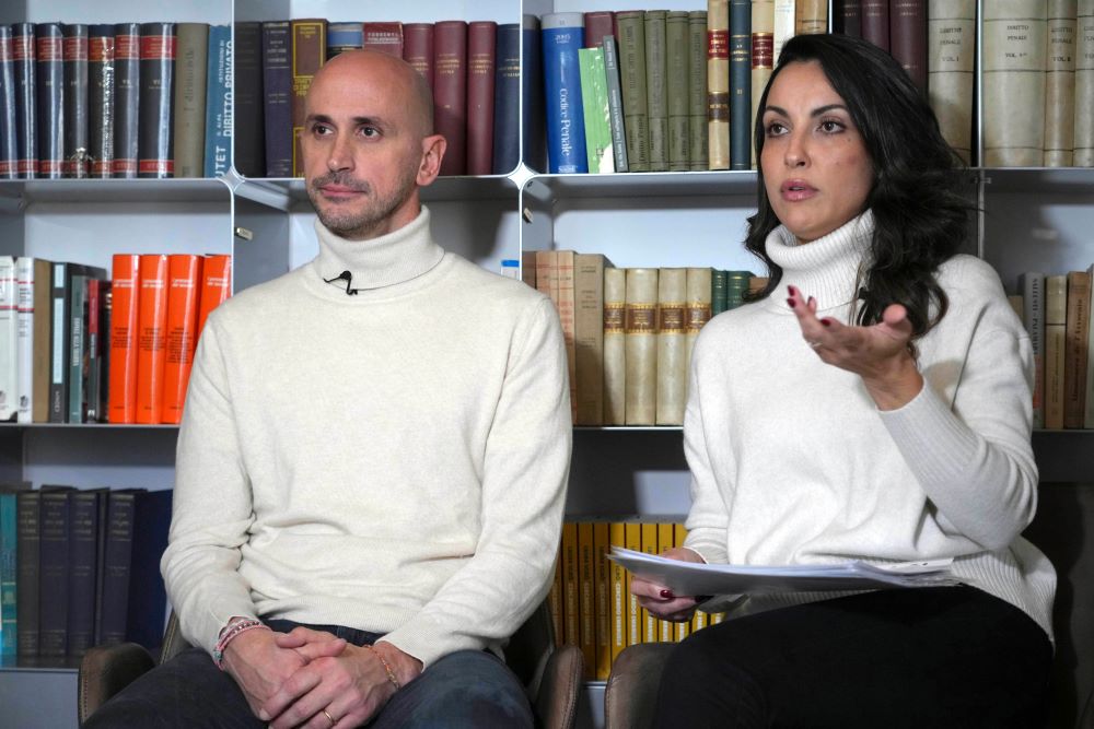 Man and woman sit for interview.