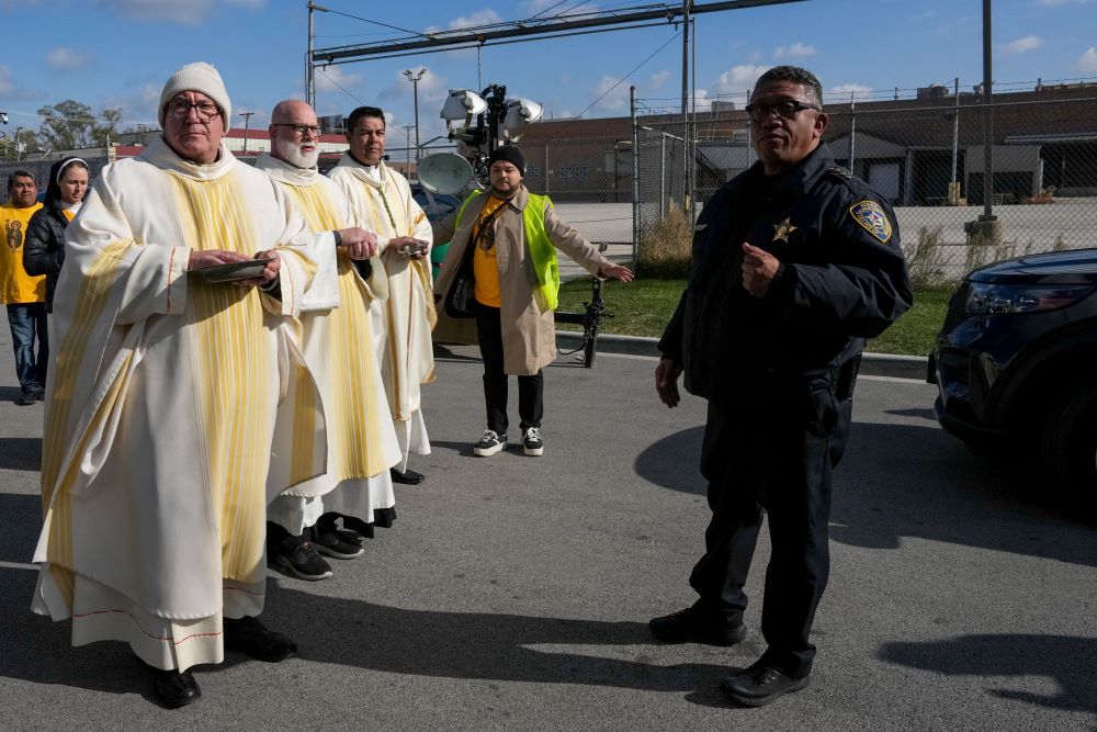 Law enforcement officers prevent clergy from entering the Broadview ICE facility to offer Communion to immigrants detained inside during an outdoor Mass in the Chicago suburb of Broadview, Illinois, Nov. 1.