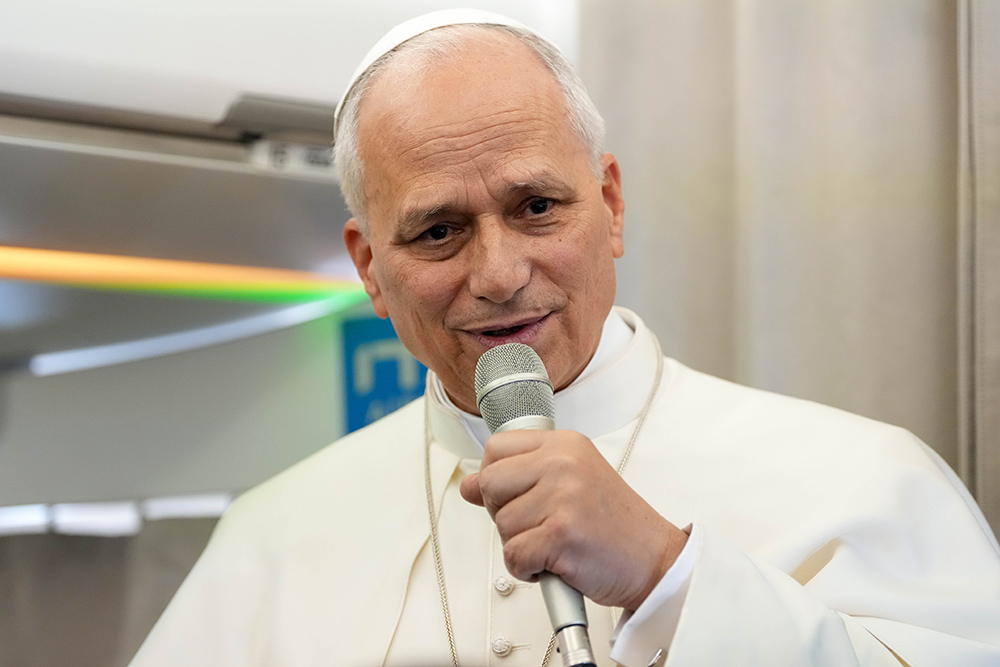Pope Leo XIV answers a question from a journalist aboard his flight back to Rome from Lebanon, Dec. 2, 2025. (CNS/Lola Gomez)