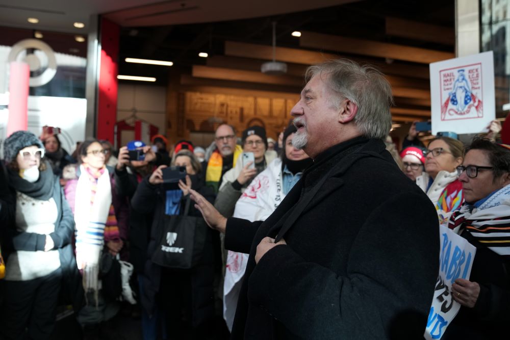 Pastor Grant Stevenson joins other protesters against federal immigration agents at Target Jan. 23 in Minneapolis. (AP/Abbie Parr)