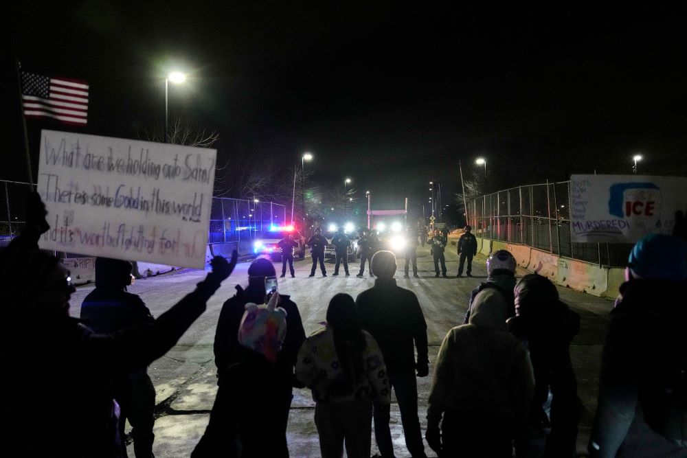 Federal immigration officers confront protesters outside Bishop Henry Whipple Federal Building in Minneapolis, on Jan. 15, 2026. (AP/Yuki Iwamura, file)
