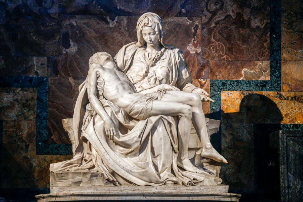 In 1972, a man took a hammer to Michelangelo's Pietà in St. Peter's Basilica, breaking the Renaissance sculpture into at least 100 pieces. A team repaired the sculpture, which is now protected by bulletproof and shatterproof glass. (CNS/Lola Gomez)