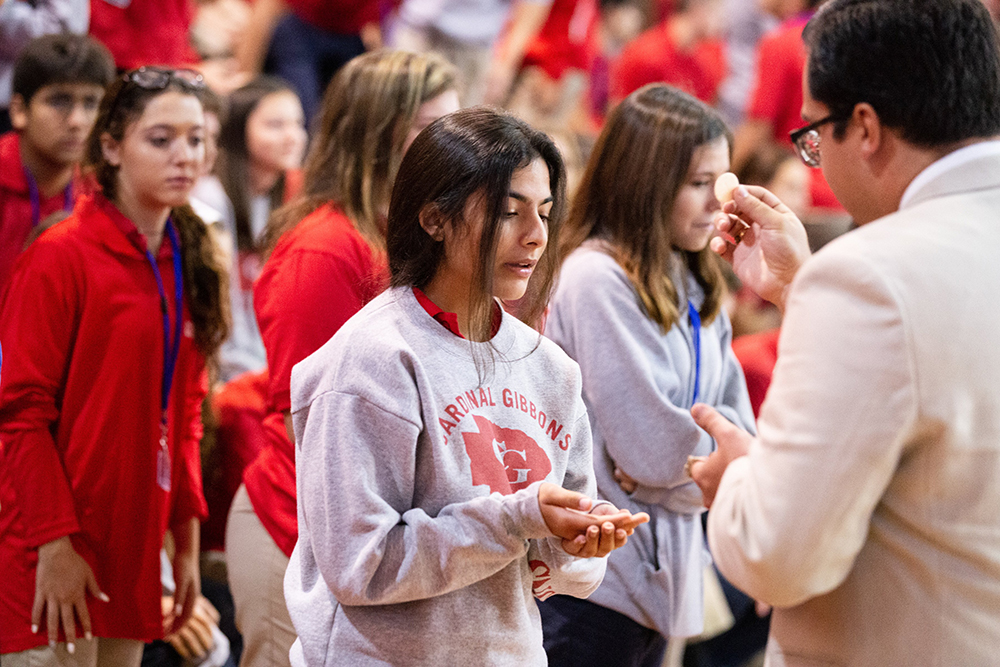 A file photo shows students at Cardinal Gibbons High School in Fort Lauderdale, Fla., receiving Communion during a Mass and rally for the opening of the school year. (OSV News/Tom Tracy)