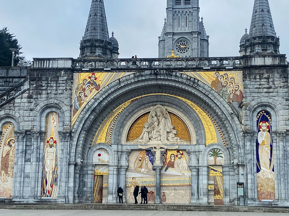 The uncovered facade of the Basilica of Our Lady of the Rosary is seen with mosaics by Fr. Marko Rupnik at the Sanctuary of Our Lady of Lourdes in southwestern France in April 2023. (OSV News photo/courtesy Greg Erlandson)