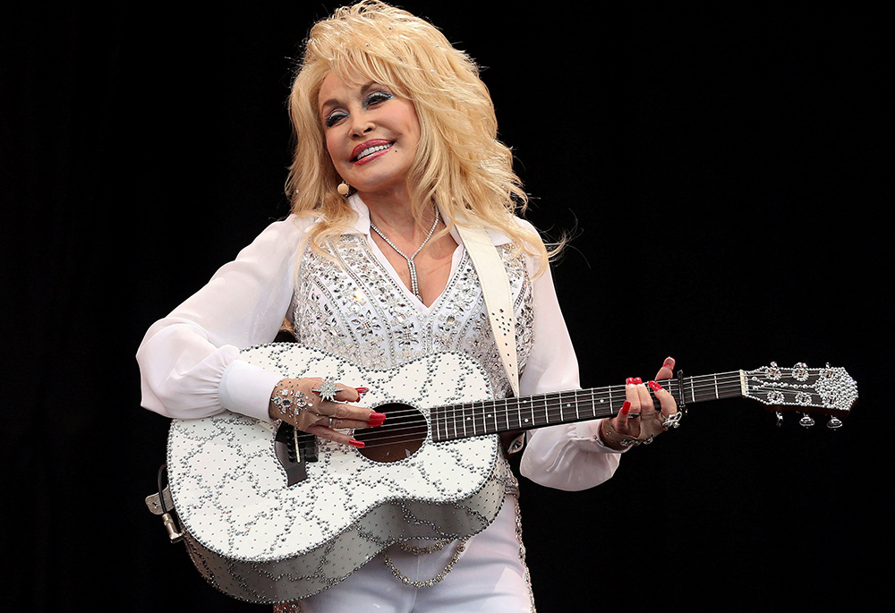 American country music star Dolly Parton performs on the Pyramid Stage at Worthy Farm in Somerset, England, during the Glastonbury Festival June 29, 2014. Parton, 80, died Aug. 25, 2026, after a brief battle with cancer. (OSV News/Reuters/Cathal McNaughton)