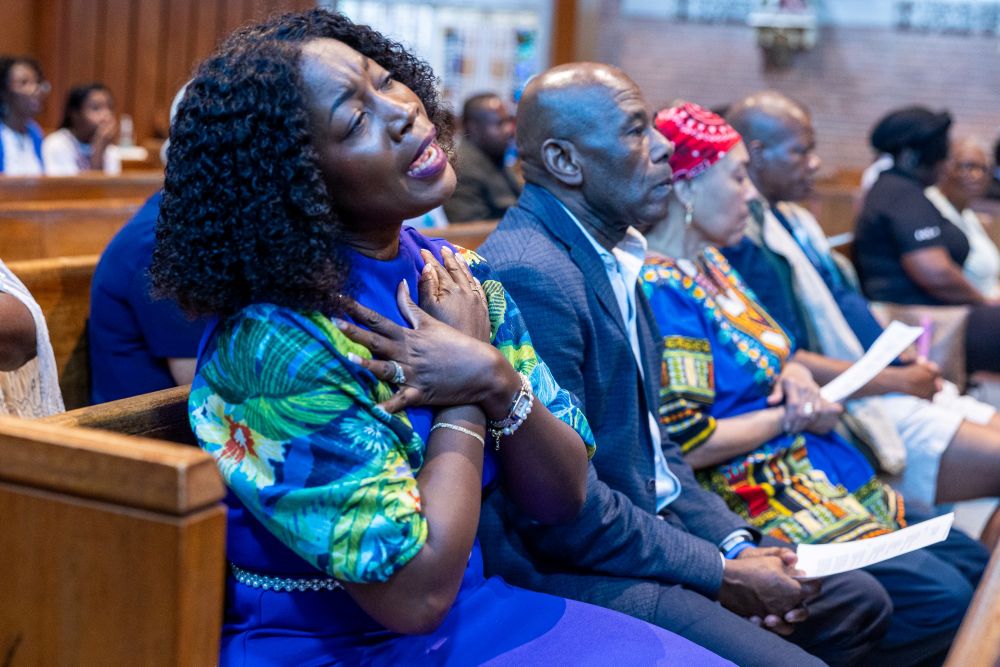 A woman sings at Our Lady of Sorrows Church in Takoma Park, Md., on July 28, 2026, during a Mass of solidarity with the Haitian community and those impacted by changes to U.S. immigration policy and Temporary Protected Status. (OSV News/Mihoko Owada, Catholic Standard)