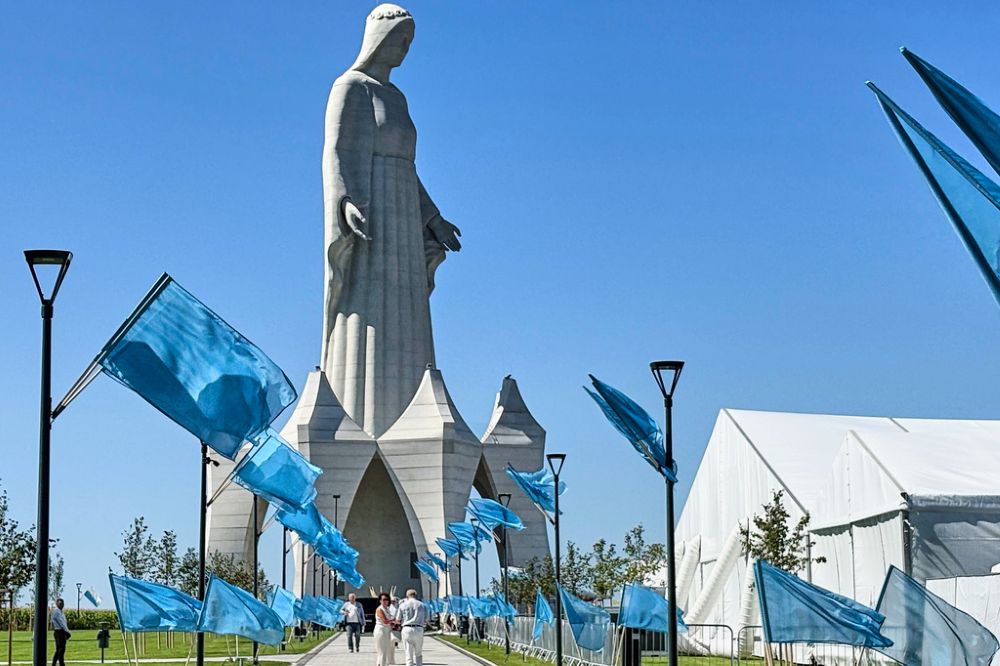 People walk inside an enormous statue of the Virgin Mary that is believed to be Europe's tallest during the inauguration in the village Konotopie, Poland, Aug. 15, 2026. (AP/Claudia Ciobanu)