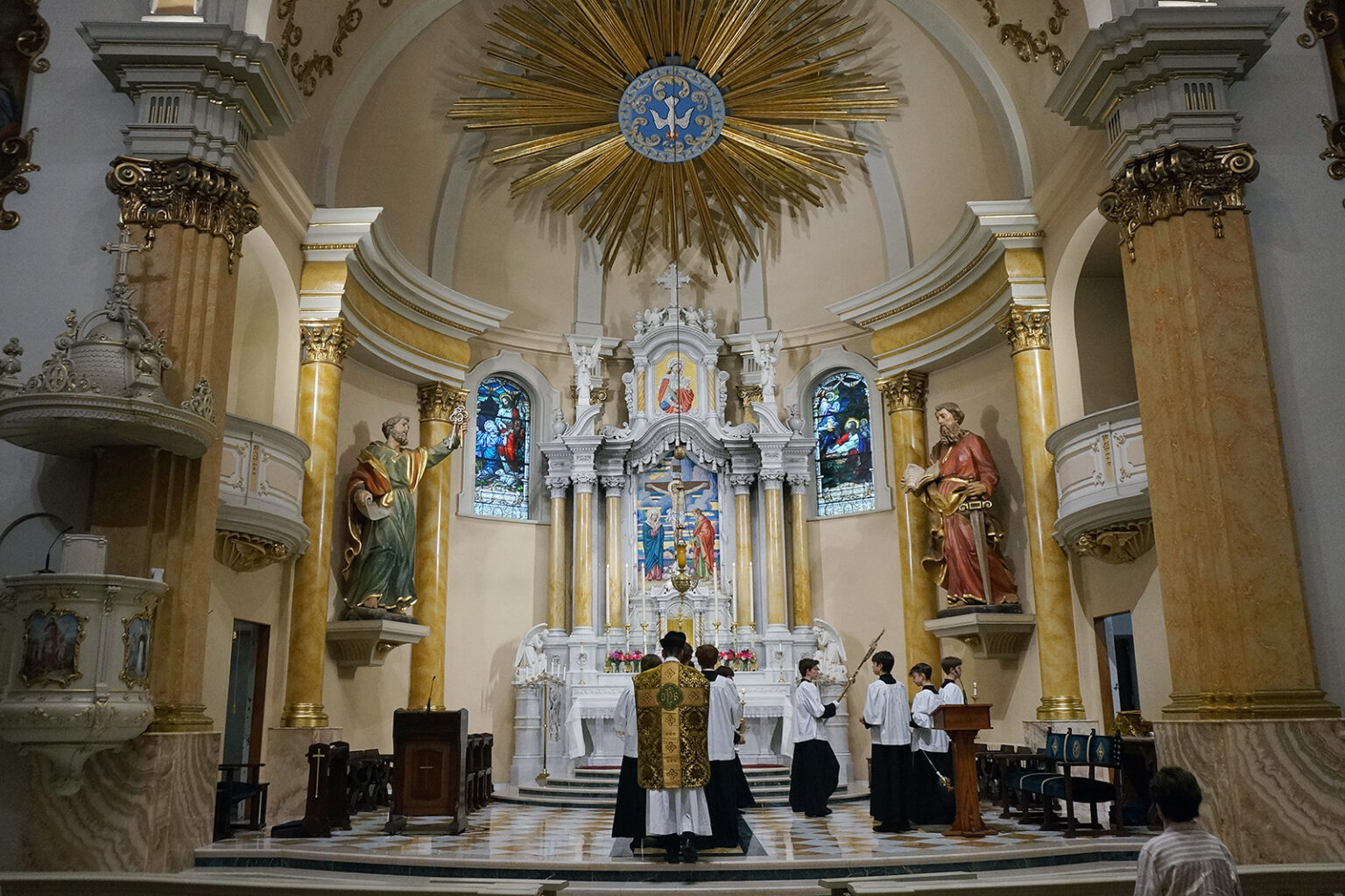 Fr. John Ubel, pastor of the Church of Saint Agnes, processes into the sanctuary with altar servers at the start of one of the Catholic parish's Latin Masses in St. Paul, Minn., June 28, 2026. (RNS/AP/Giovanna Dell'Orto)