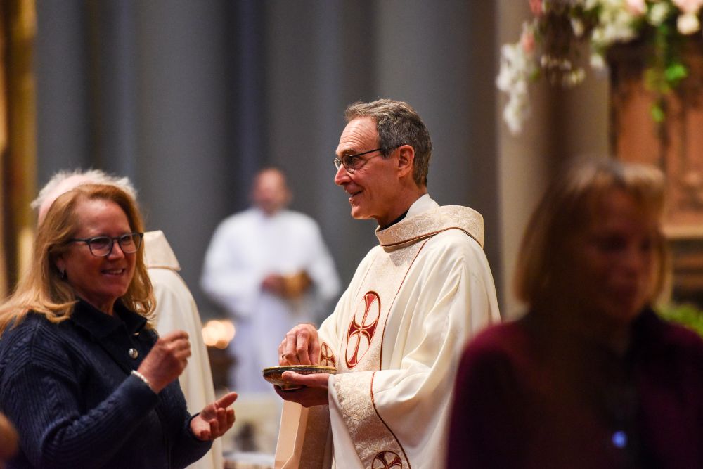 Jesuit Fr. Gregory Bonfiglio, pastor of St. Ignatius Parish in San Francisco, celebrates Mass in late April 2026. Bonfiglio wrote that the parish paying its assessment for the archdiocese's  settlement of clergy sex abuse cases was "an act of solidarity with survivors." (Courtesy St. Ignatius Parish)