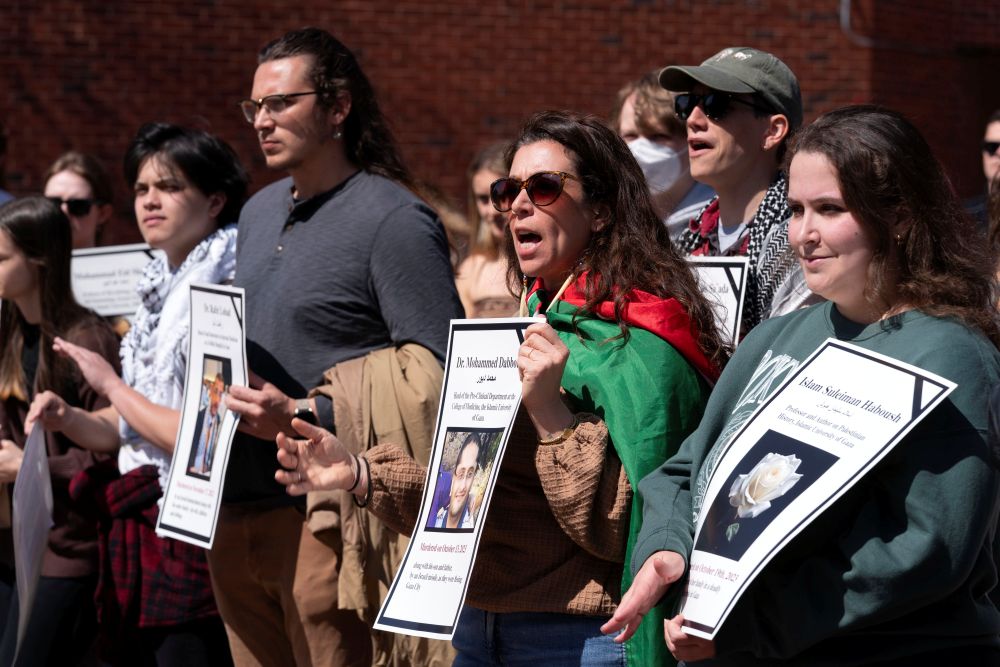 Georgetown University students hold pictures of people killed in Gaza as they rally in support of Badar Khan Suri, a Georgetown University professor, demanding his release from a deportation process over his views on Palestinian and the war in Gaza, at Georgetown University in Washington, March 25, 2025. (AP/Jose Luis Magana)