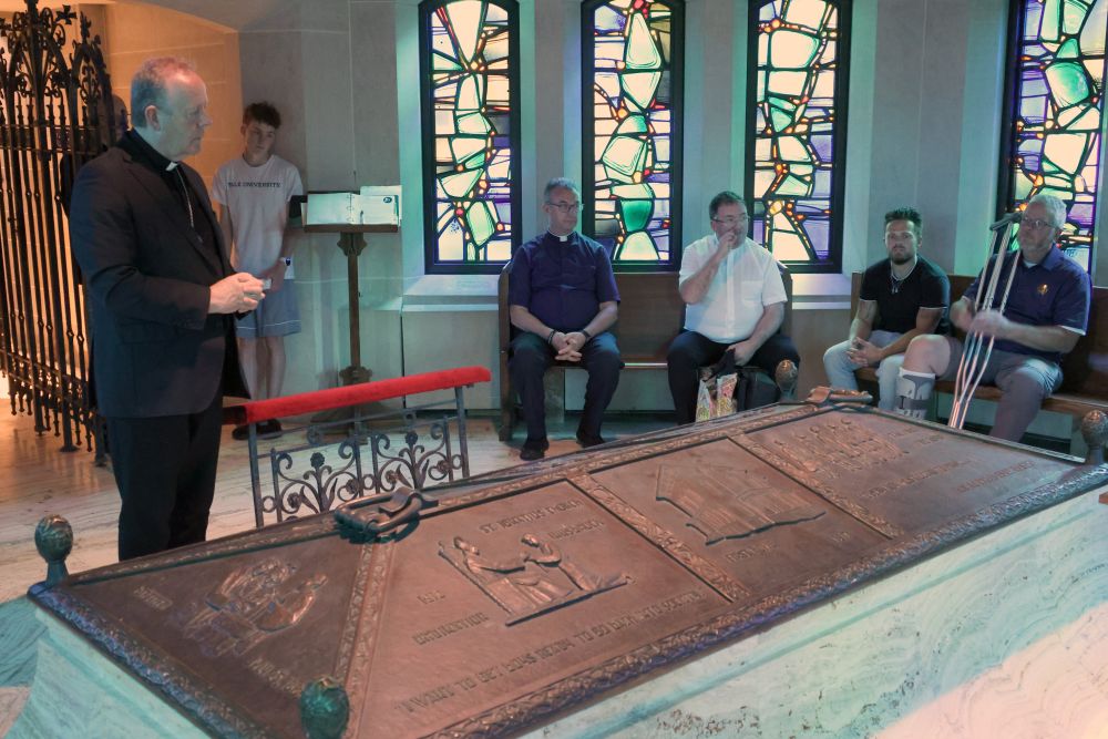 Irish Archbishop Eamon Martin of Armagh prays near the tomb of Venerable Fr. Edward Flanagan, founder of Boys Town, at Dowd Memorial Chapel of the Immaculate Conception in Omaha July 16, 2026. The parish serves the village of Boys Town. (OSV News/The Catholic Voice/Riley Johnson)