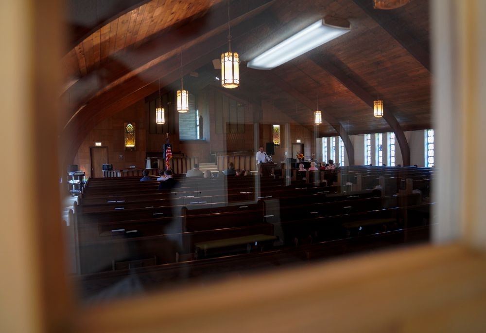 Pastor Ryan Burge preaches a Sunday sermon at a nearly empty First Baptist Church in Mount Vernon, Ill., Sept. 10, 2023. The church held the last service of its 156-year history in July 2024. (AP/Jessie Wardarski)