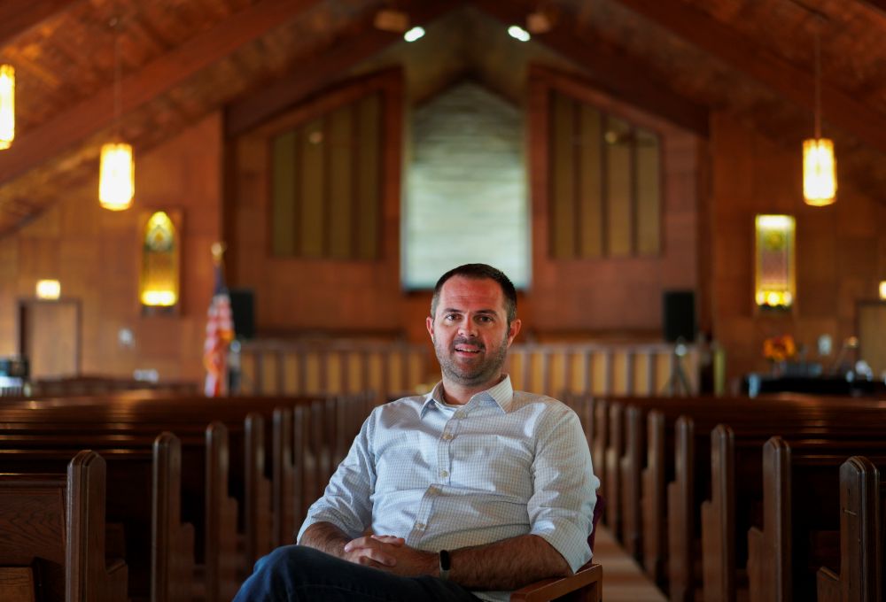 Ryan Burge, a sociologist, professor at the John C. Danforth Center on Religion and Politics at Washington University, and author of "The Vanishing Church," poses for a portrait at First Baptist Church in Mount Vernon, Ill., Sept. 10, 2023. (AP/Jessie Wardarski)