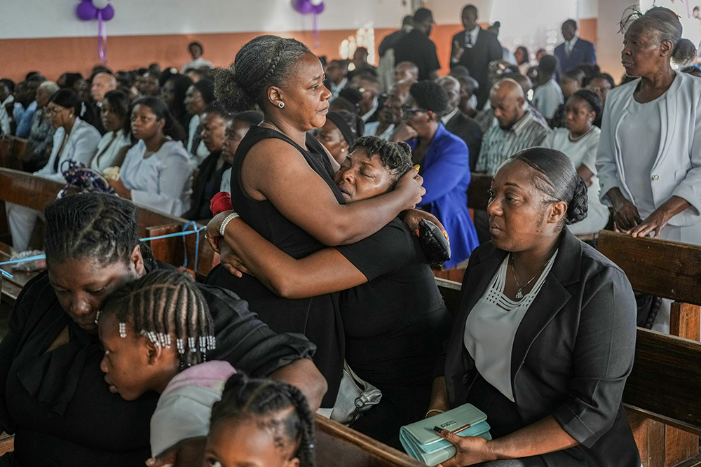 On Aug. 30, 2026, relatives attend the funeral ceremony for four victims of a gang attack in the Kenscoff neighborhood of Port-au-Prince, Haiti. (AP/Odelyn Joseph)