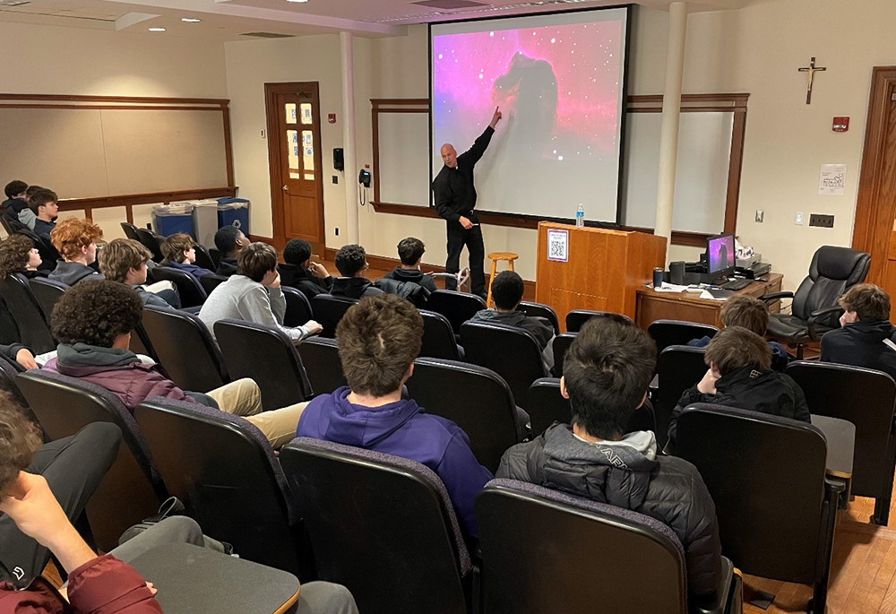 Jesuit in formation Rob Lorenz gives a presentation for Gonzaga College High School in Washington, D.C. (Courtesy of Ronald Jacobs)