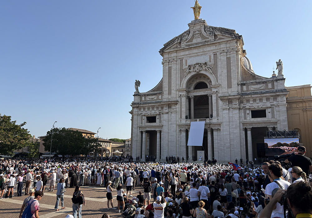 Pope Leo XIV speaks to young Franciscans gathered in the square outside the Basilica of Santa Maria degli Angeli in Assisi, Italy, Aug. 6, 2026. (NCR photo/Camillo Barone)